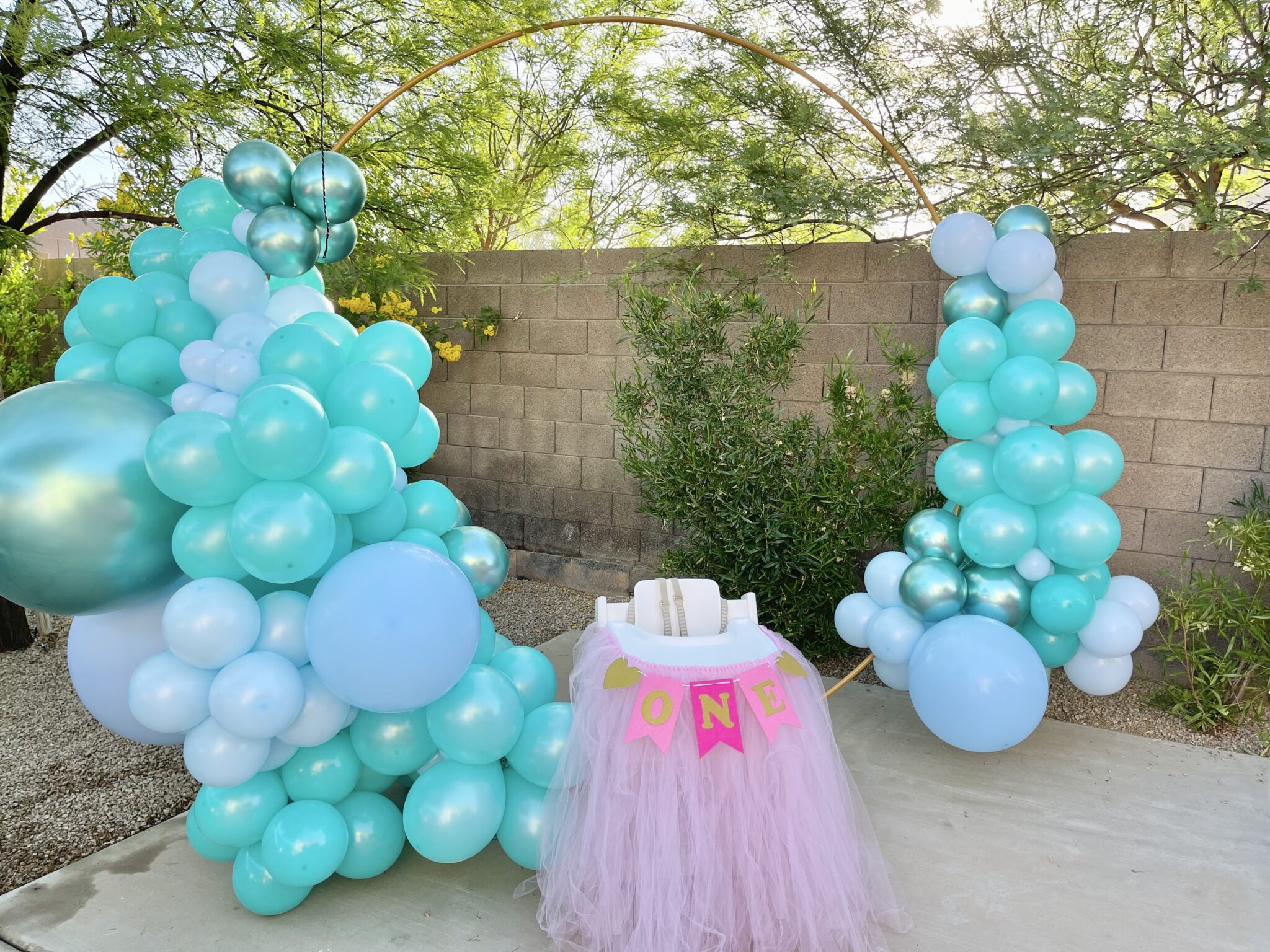 Pastel balloon installation for a first birthday
