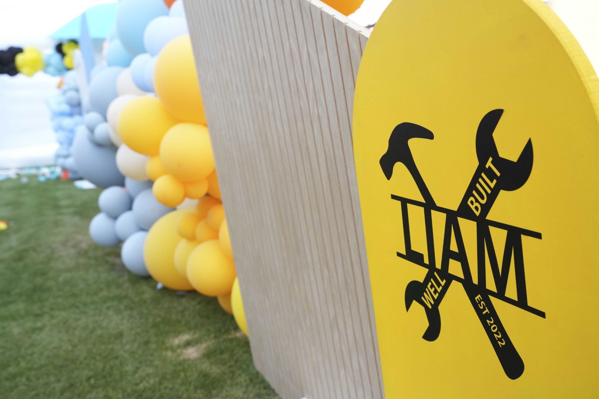 Birthday party styling with balloons and signage