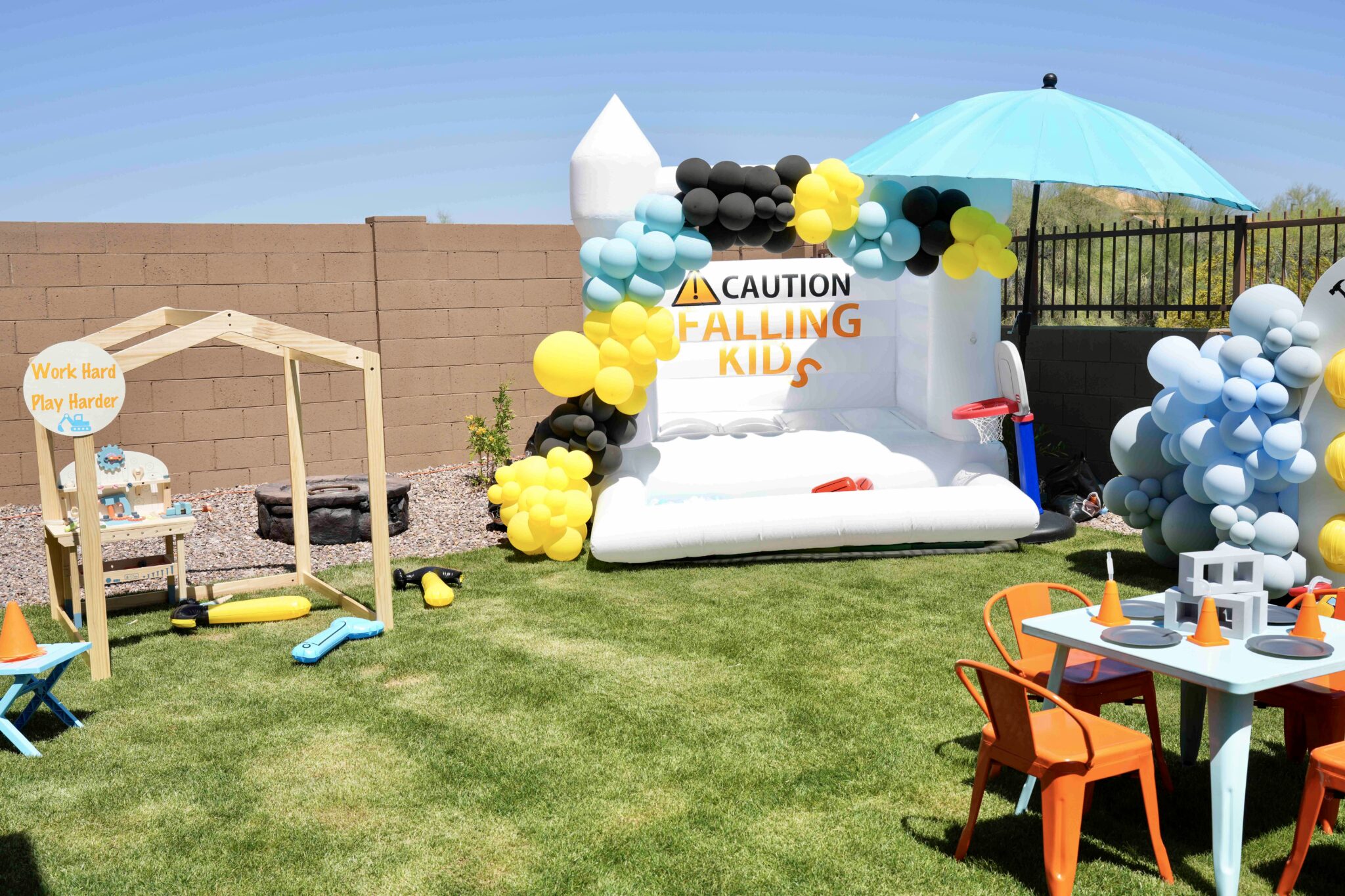 Balloon garland framing a dessert table