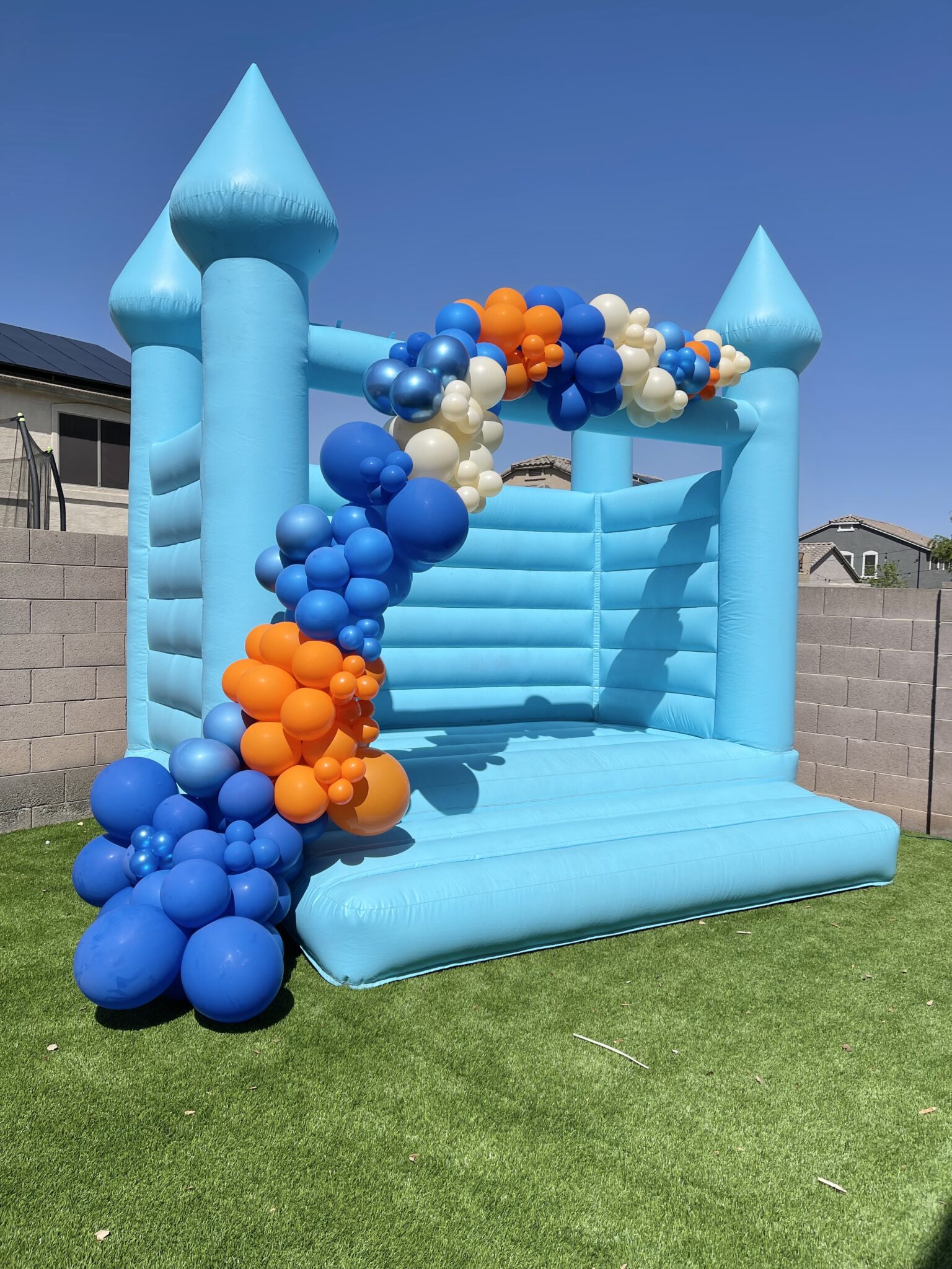 Pastel balloon installation for a first birthday